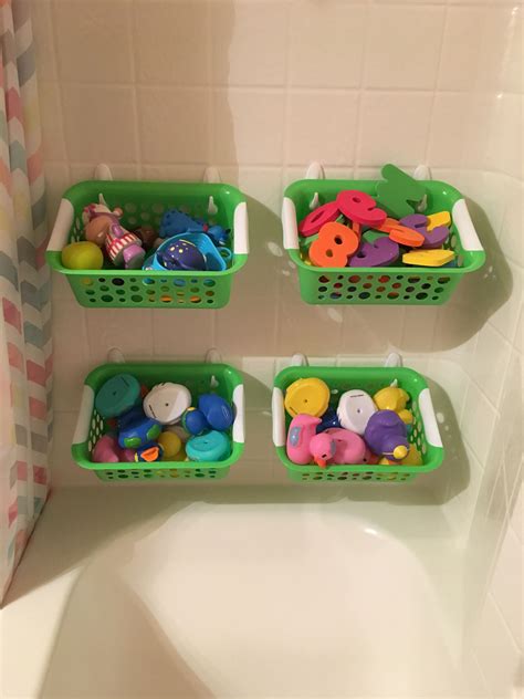 Bathroom toy organization. Bins from Dollar Tree and command hooks ...