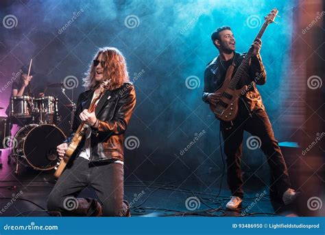 Electric Guitar Players with Rock and Roll Band Performing Hard Rock Music Stock Photo - Image ...