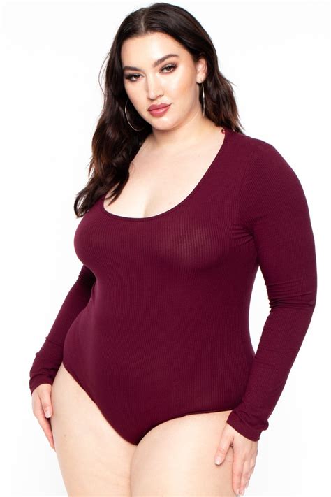 This plus size, stretch ribbed knit bodysuit featuring a scoop neckline, long sleeves and a dual ...