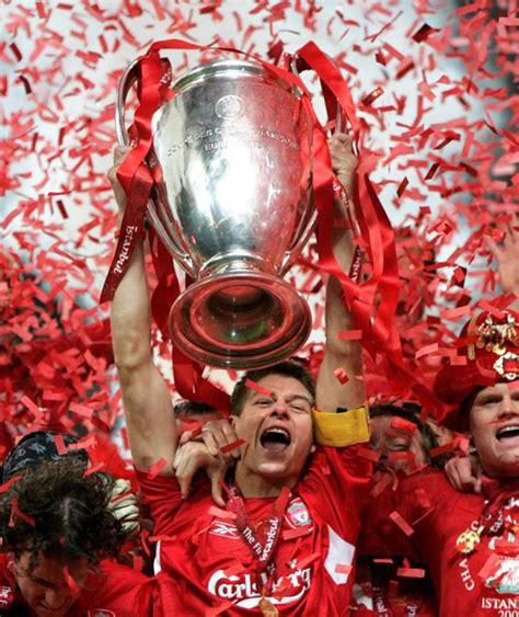 Liverpool captain Steven Gerrard lifts the UEFA Champions League trophy ...