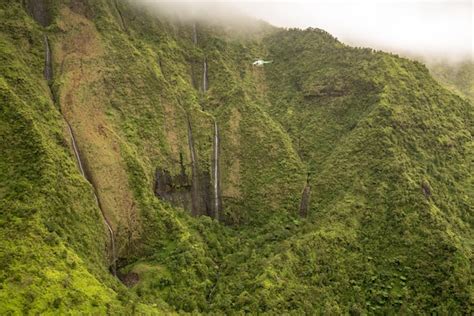 Premium Photo | Aerial view of waterfalls in crater of mount waialeale on hawaiian island of ...