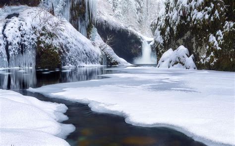 Waterfall on frozen river in the rocky mountains wallpaper - Nature ...