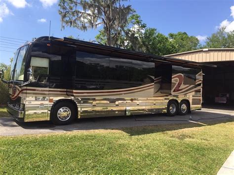 Tour Bus Parked in Front of Garage