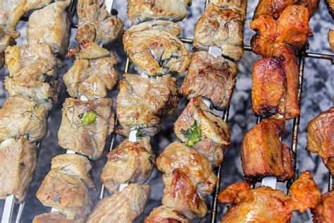 Russian shashlik with skewers on a round grill. 4683917 Stock Photo at ...