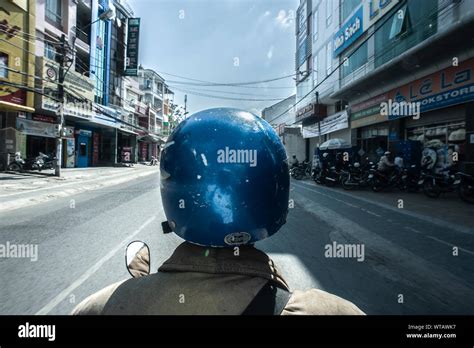 Motorcycle taxi-driver wearing vintage`s blue helmet Stock Photo - Alamy