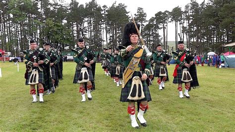 Mace flourish by Drum Major Derek Dean leading Huntly Pipe Band during 2019 Tomintoul Highland ...