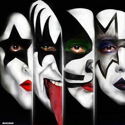 the faces of four clowns painted in white and black with red lips, nose rings, and green eyes