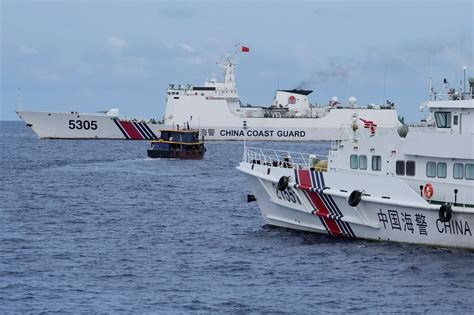 Philippine boats breach Chinese coast guard blockade in faceoff near disputed shoal | The Asahi ...