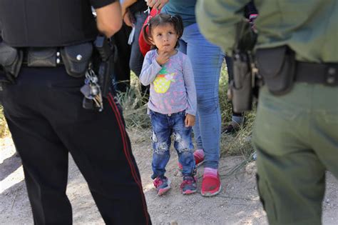 Father and son - Border children: Immigrant families in crisis ...