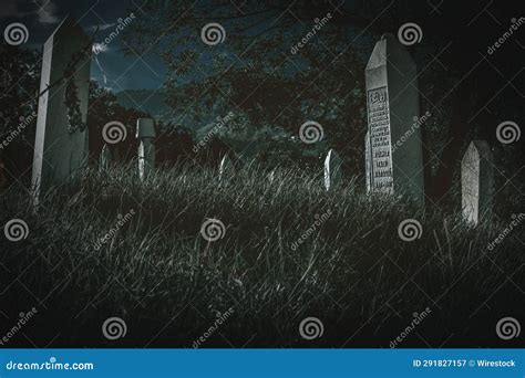 A Creepy Graveyard in Front of a Blue Sky at Night Editorial ...