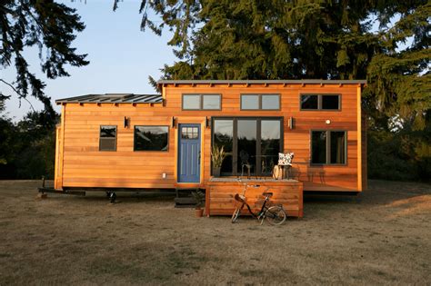 Wooden front porch tiny house exterior design | EasyHomeTips.org