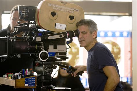 Director/producer/screenwriter/star George Clooney lines up a shot on ...