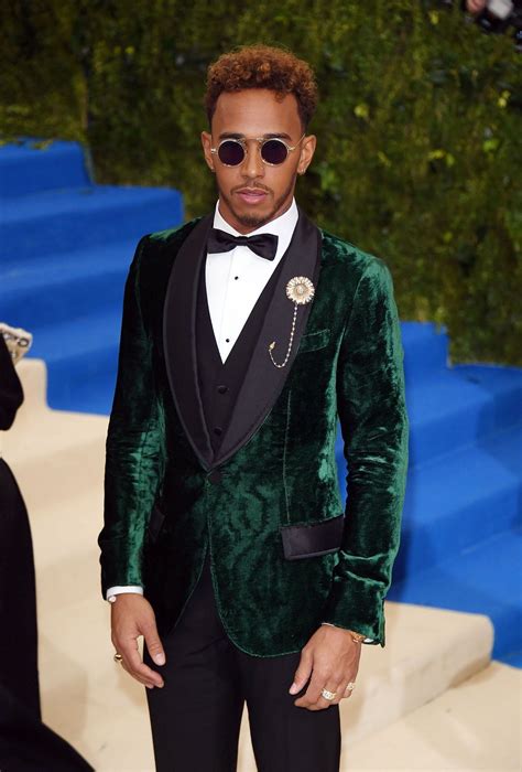 Lewis Hamilton wore a Dolce&Gabbana Alta Sartoria single breasted tuxedo in dark green moiree ...