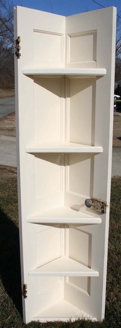 SOLD- White corner shelf made of door split down the middle, architectural spindles added. Great ...