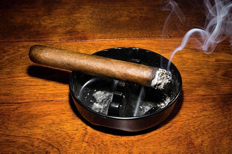 Cigar smoking in ashtray Photograph by Joe Belanger - Fine Art America