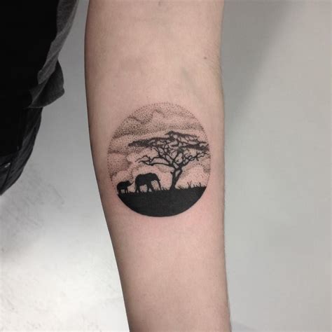 Circular African landscape tattoo on the left forearm | Africa tattoos, African tattoo ...