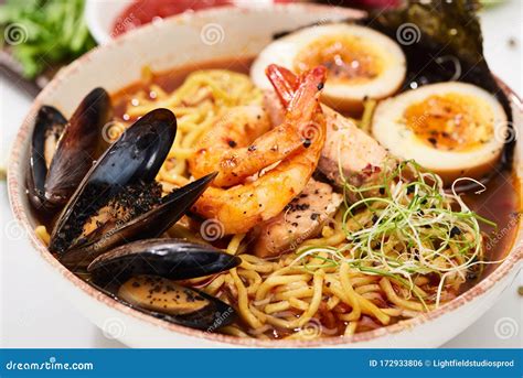 Close Up View of Spicy Seafood Ramen with Mussels and Shrimps in Bowl ...