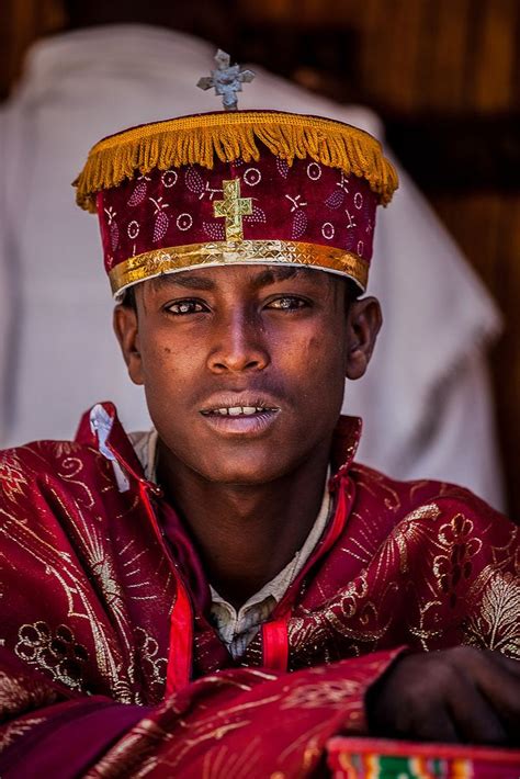 portrait young priest who celebrates the festival Hosanna (Palm Sunday) in Axum, tigray Black Is ...