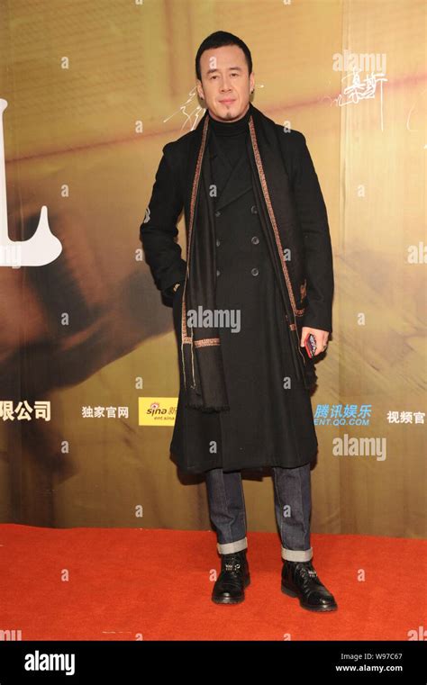 Chinese singer Yang Kun poses on the red carpet as he arrives for the ...