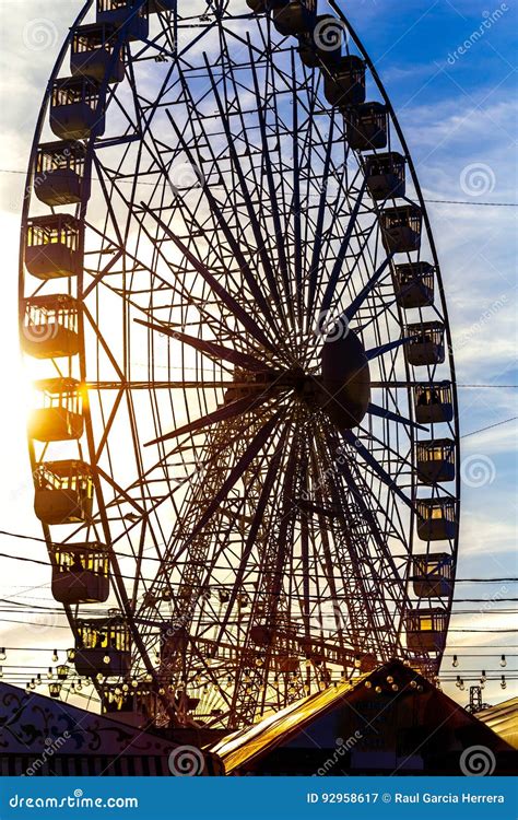 Silhouette of Ferris Wheel at Sunset. Stock Image - Image of europe, seville: 92958617