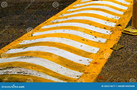 Yellow and White Speed Breaker in a Highway Streets Stock Image - Image ...