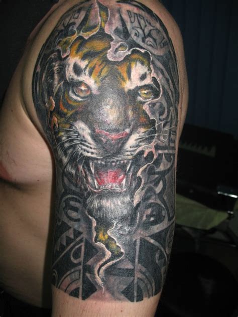 Very realistic looking colored angry tiger tattoo on shoulder ...