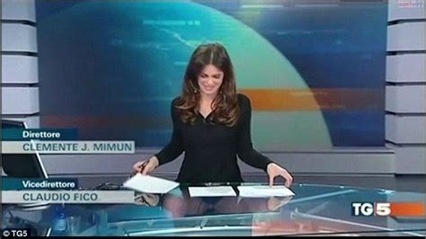 Italian presenter behind a glass desk gives viewers a real news flash