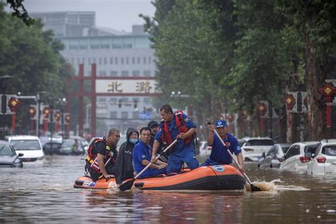 At least 20 dead and 27 missing in floods surrounding Beijing, thousands evacuated ...