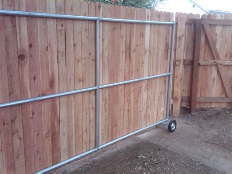 Wood roll gate - Denver Fence Company | Andrew-Thomas Contractors | Wood fence gates, Sliding ...