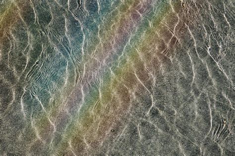 rainbow reflection on the water in the swimming pool 17556573 Stock Photo at Vecteezy