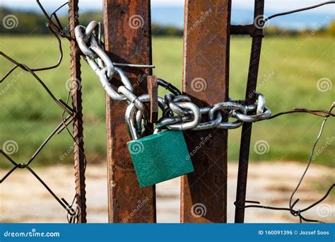 Old Rusty Gate Locked with Padlock Stock Photo - Image of border, locked: 160091396