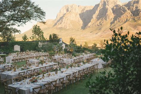 a long table set up in front of mountains