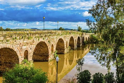 The Puente Romano Is A Roman Bridge Photograph by Marcelino Ramirez - Fine Art America