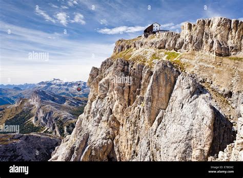 Rifugio Lagazuoi mountain hut with a cable car, overlooking the Puez ...