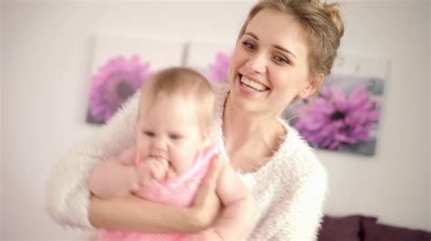 Happy Mother Playing With Baby On Hands Stock Footage SBV-323718935 ...