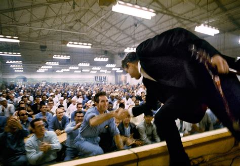 [1968] Johnny Cash shaking hands with the crowd at Folsom Prison, photograph by Jim Marshall ...