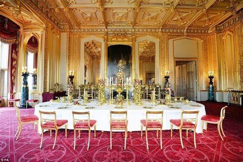 A decorated dining table laid with silver gilt from the George IV Grand ...