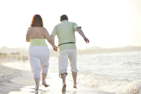 happy seniors couple on beach 12642036 Stock Photo at Vecteezy