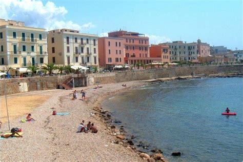 This beach spreads out right in front of some beautiful buildings in ...