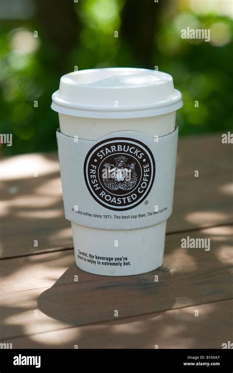 Starbucks coffee cup showing new logo Stock Photo - Alamy