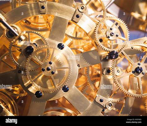 Vintage clock mechanism, fragment with many shiny gears Stock Photo - Alamy