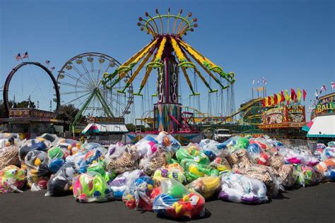 many bags of sand sitting in front of a carnival ride