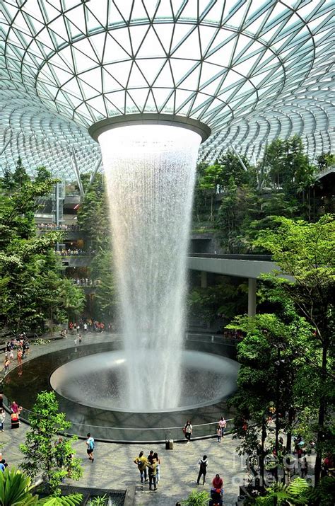 The Jewel waterfall monorail track gardens and visitors Changi Airport ...