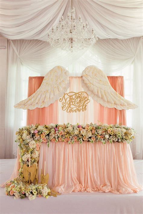 Wings are pretty, but I just need the table with those fresh flowers ...