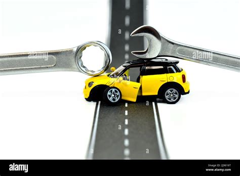 broken toy car with metal wrench tool Stock Photo - Alamy