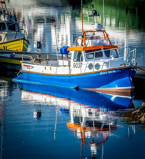 Reflections of Fishing | A small fishng trawler sits moored … | Flickr