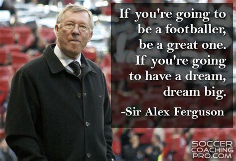 an older man standing in front of a stadium with a quote from sir alex ...