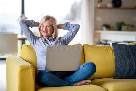 Senior Woman with Laptop on Sofa Indoors at Home, Relaxing. Stock Photo - Image of leisure ...