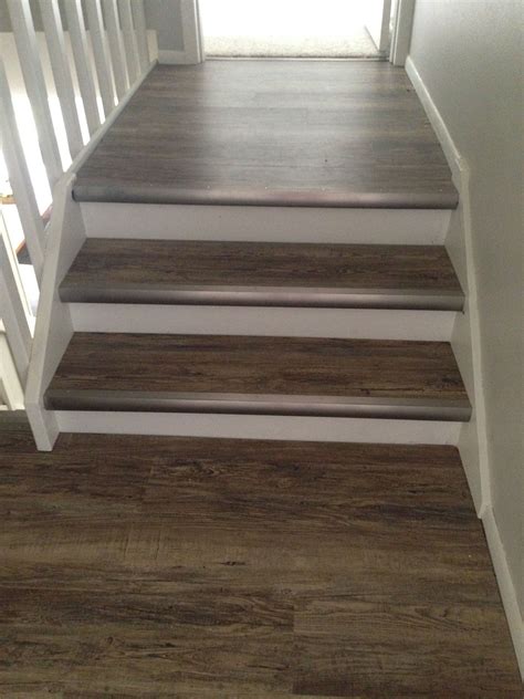 First time using vinyl plank on treads, with painted risers. Nice thick ...