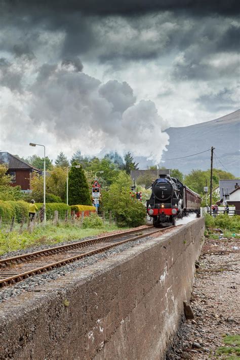 CORPACH, SCOTLAND, UK, 2011. The Jacobite leaving the station 6981609 Stock Photo at Vecteezy